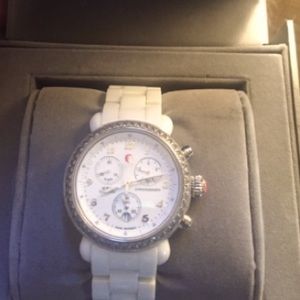 Previously owned Michele watch. Comes with box and card. Condition slightly worn